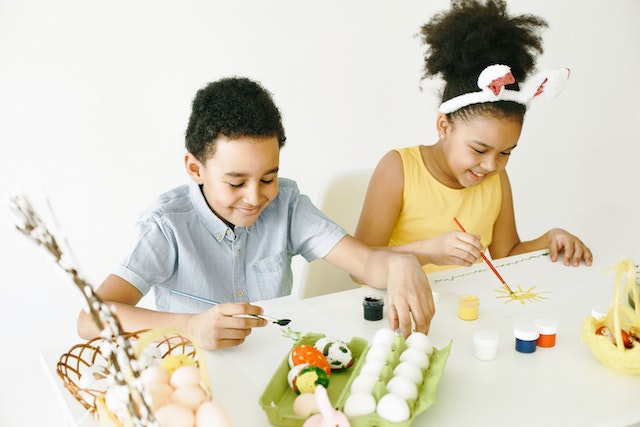 Kids painting Easter eggs during Easter celebrations